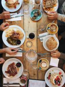 assorted variety of foods on plates on dining table